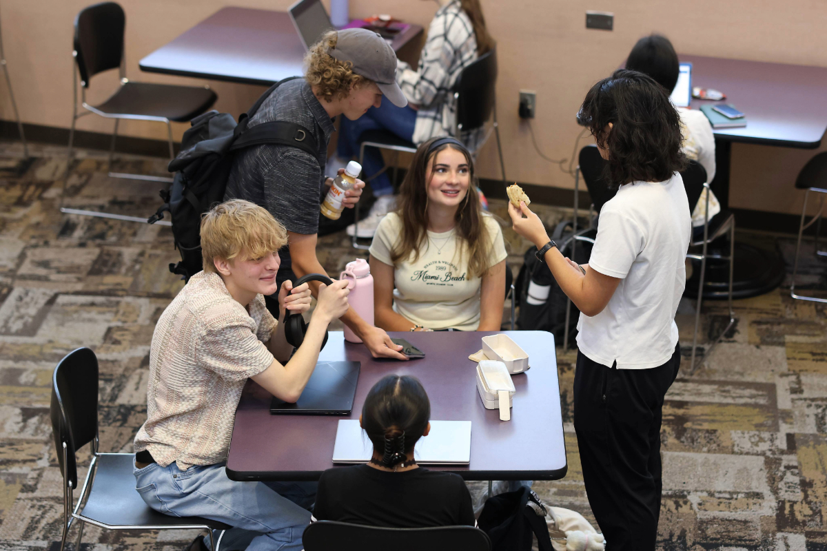 Students studying together at a cafe table