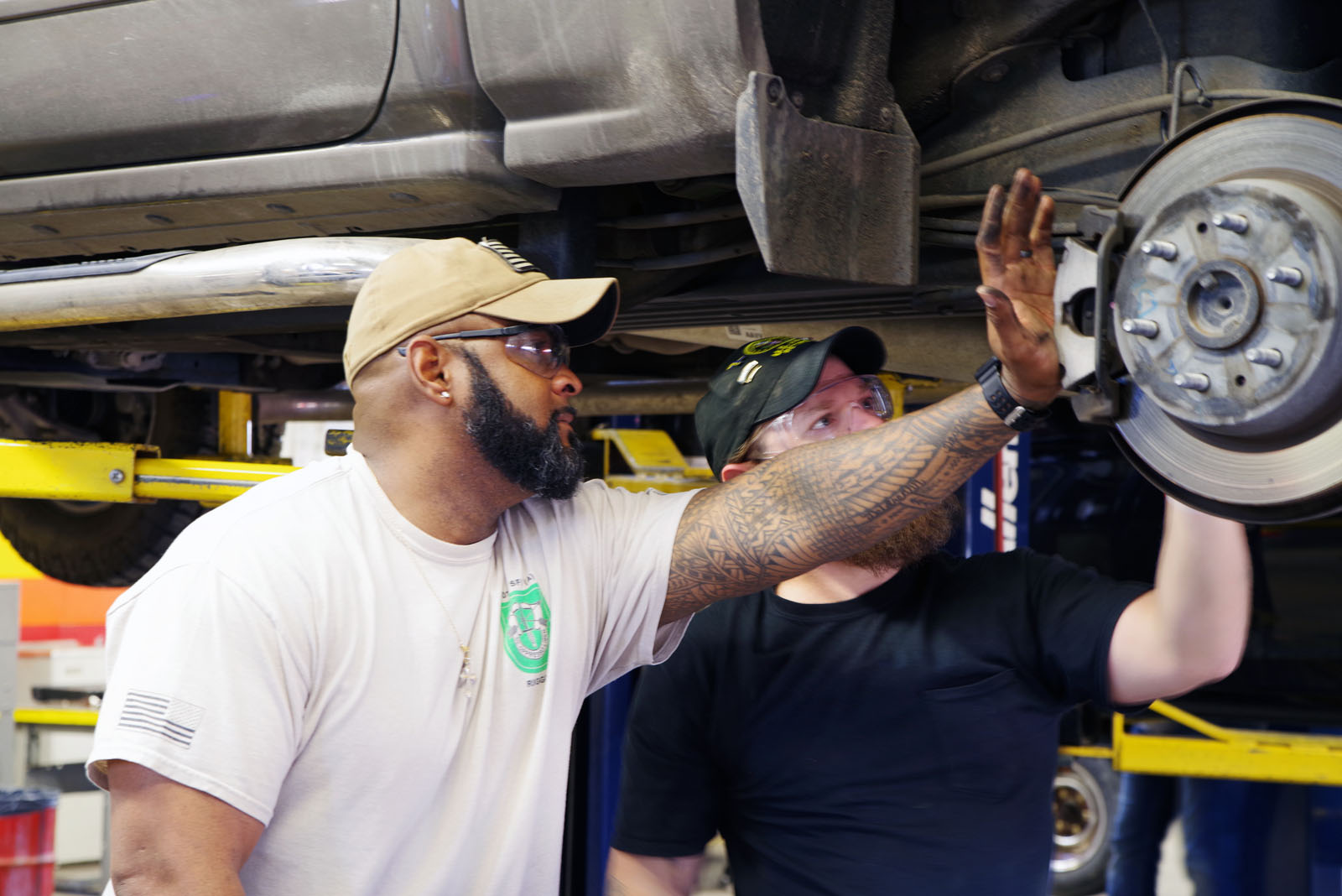 auto tech students with car