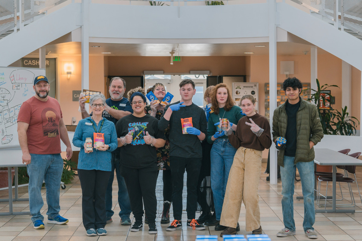 group of people helping with mobile food market at rampart range campus
