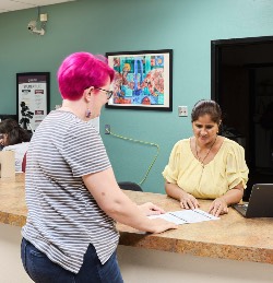 Student and Staff at Front Desk