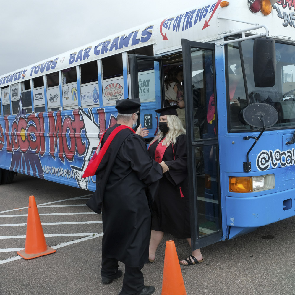 Students getting on a bus