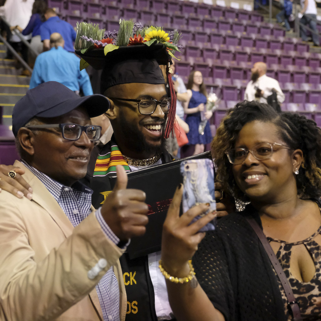 PPSC graduate and family at commencement ceremony