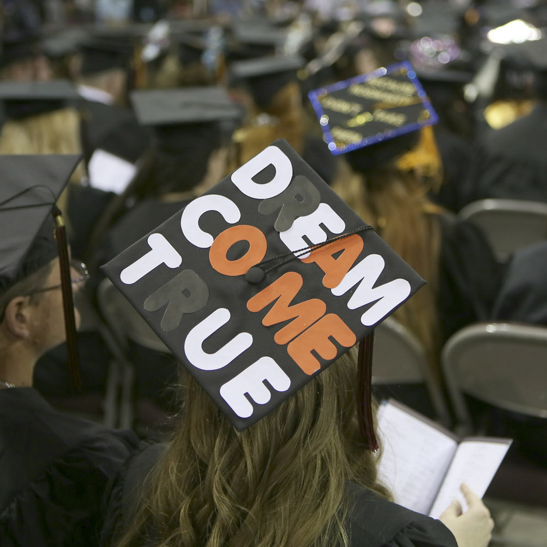 Graduate with "Dream Come True" written on her hat