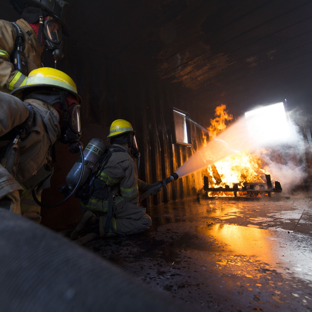 Pikes Peak State College Fire Science Students practice putting out a fire during a training exercise.