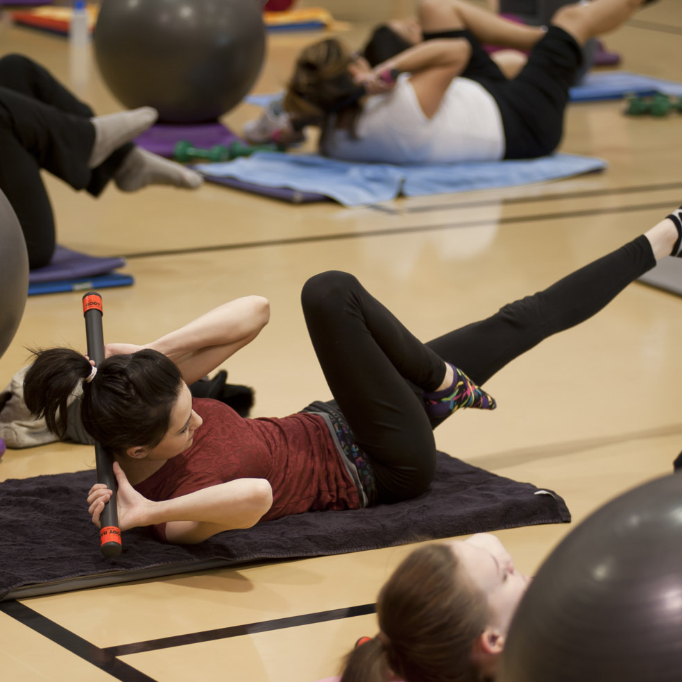 Student working out in the gym. 