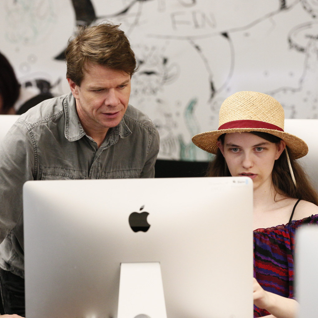 teacher and student at computer