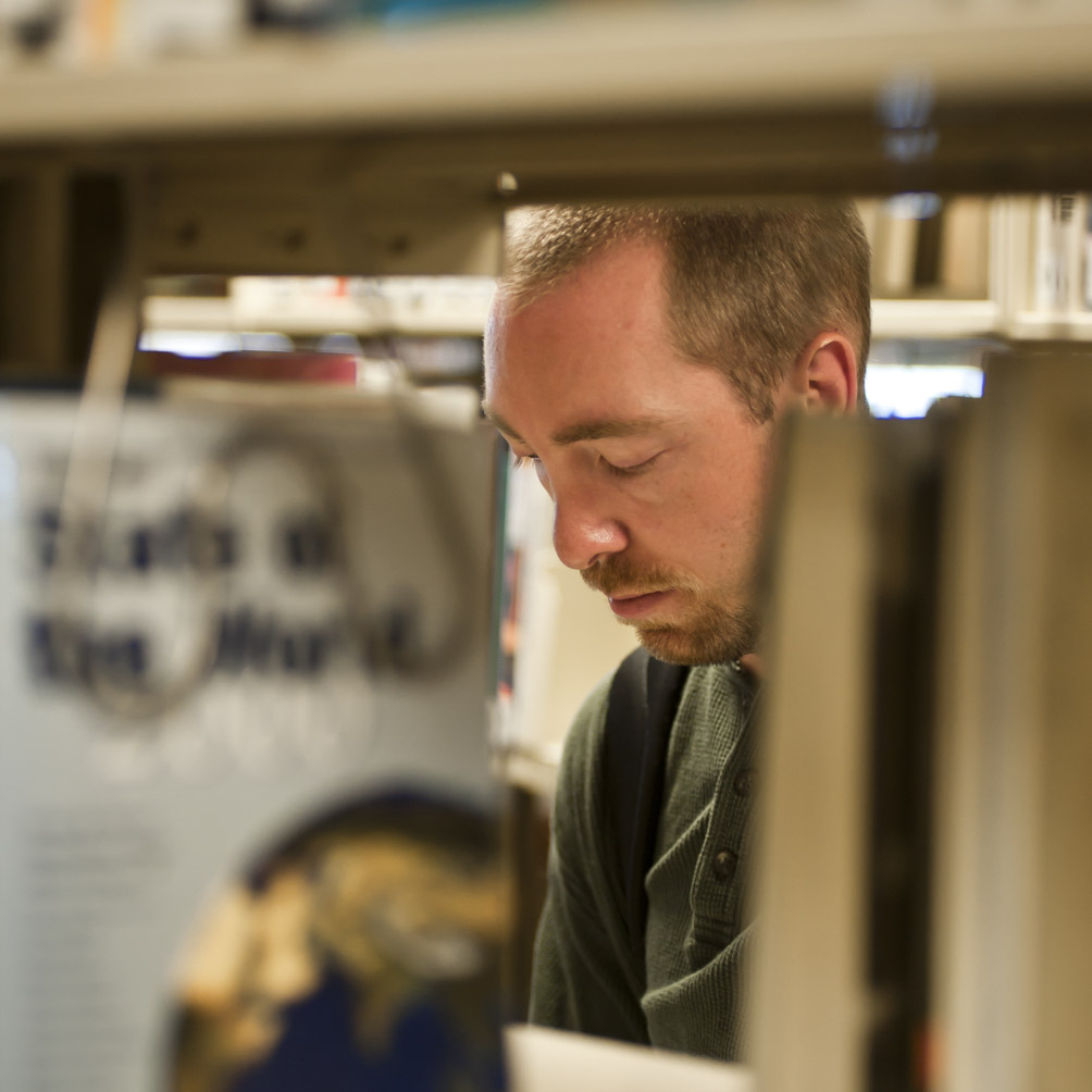 Man in library stacks