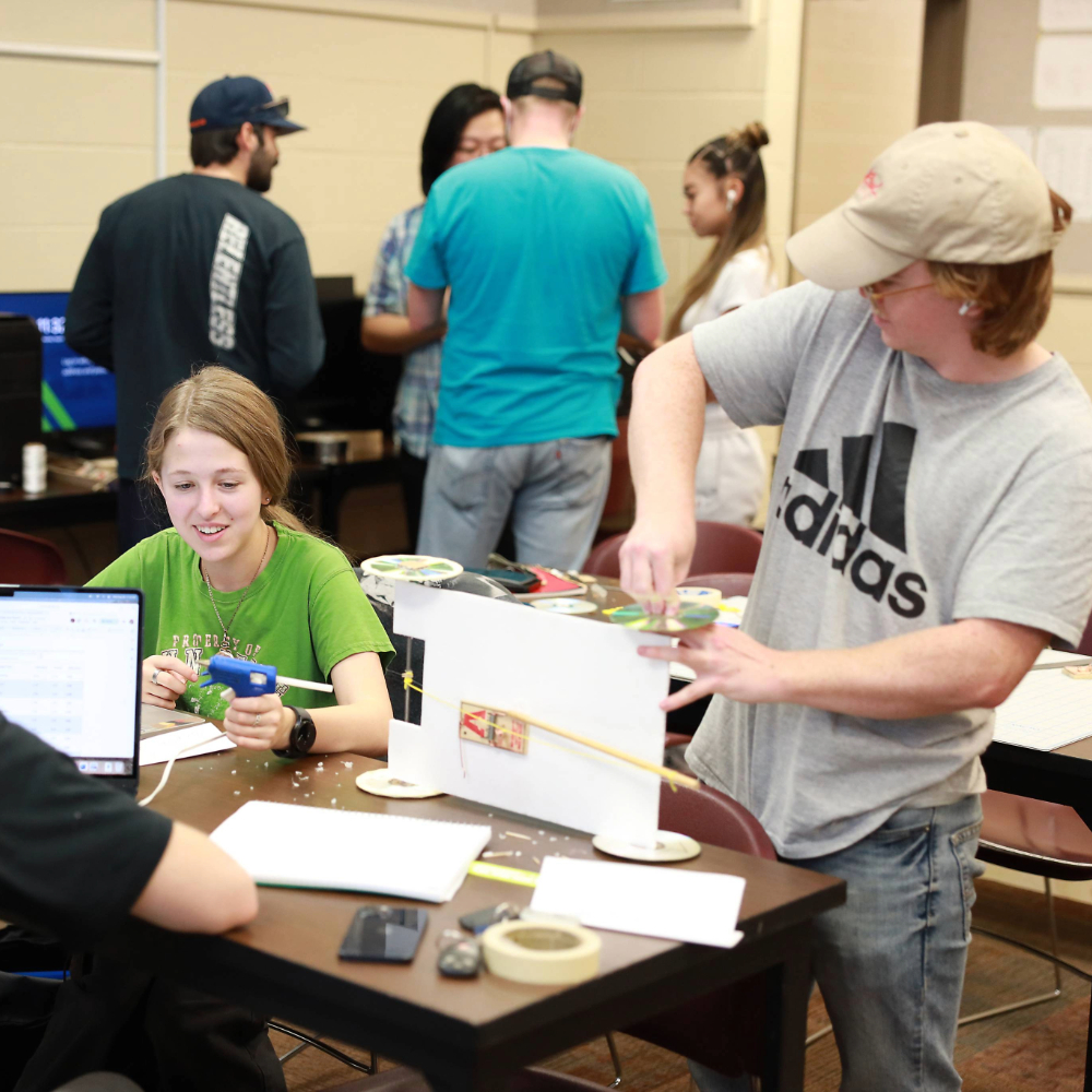 Students building models in class