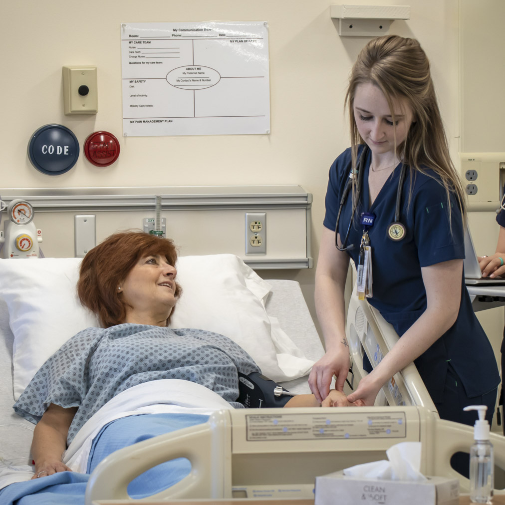 nursing student with paitent in class