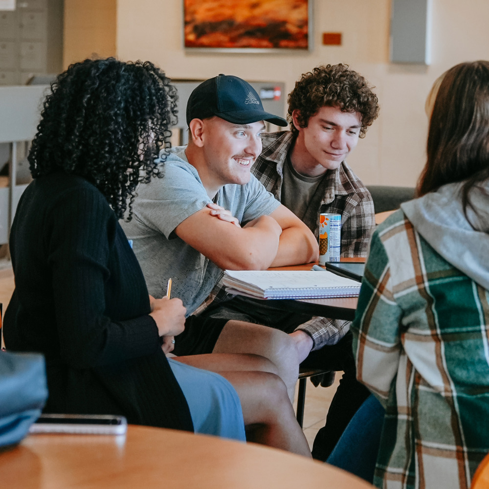 4 students studying around a table