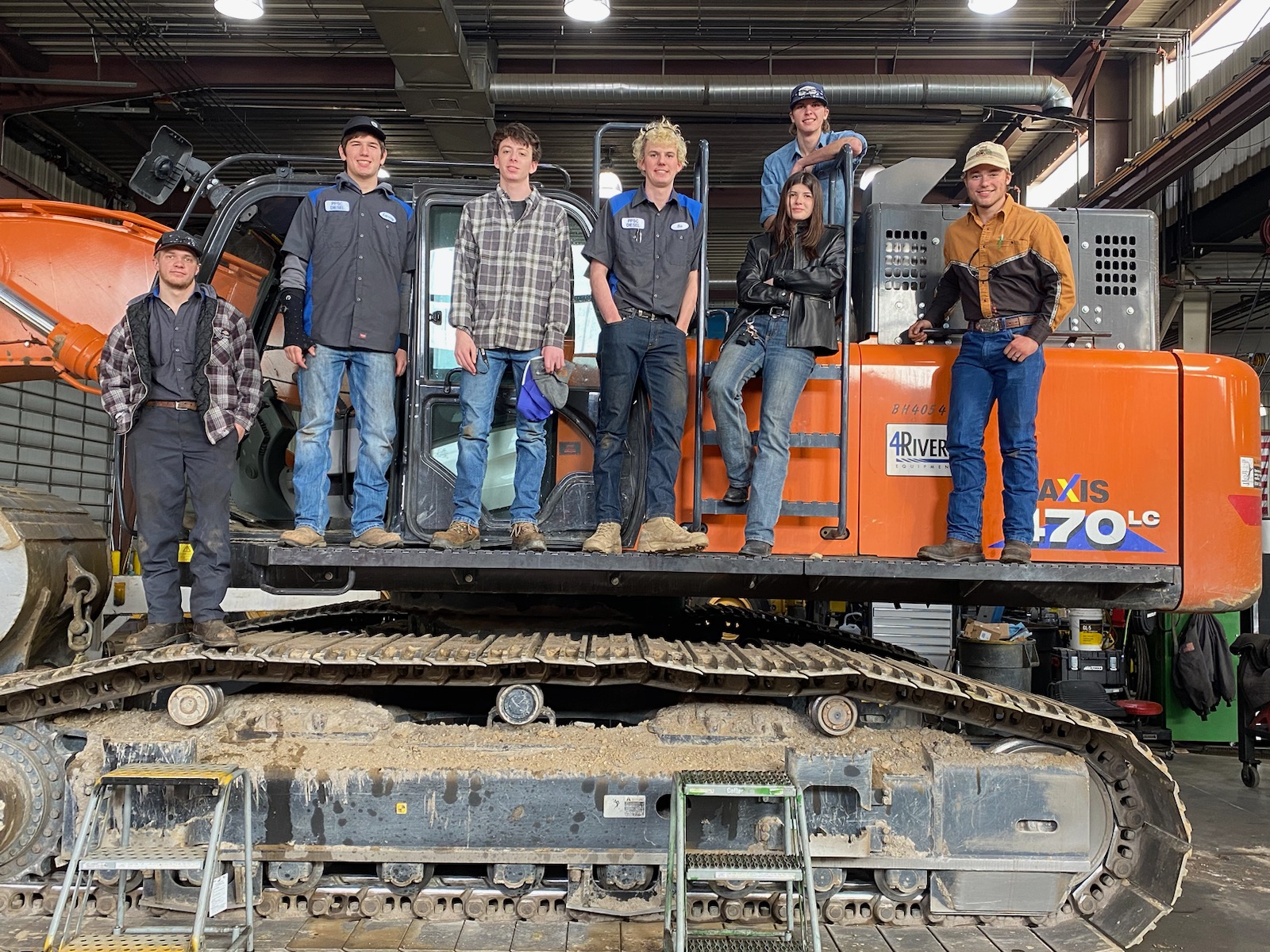 Diesel Technology students pose with machinery 