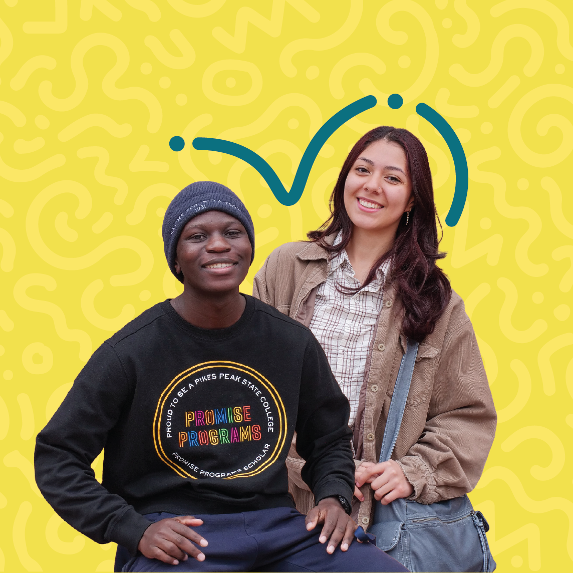 two students smiling at camera