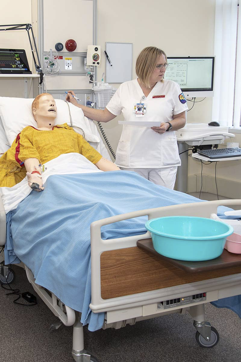 Female student with manikin