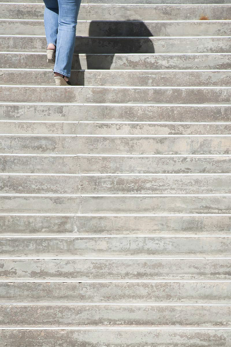 person walking up steps