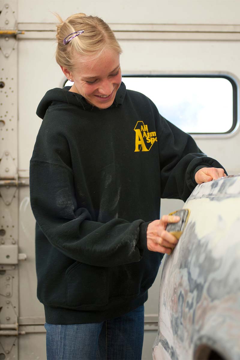 Student working on vehicle