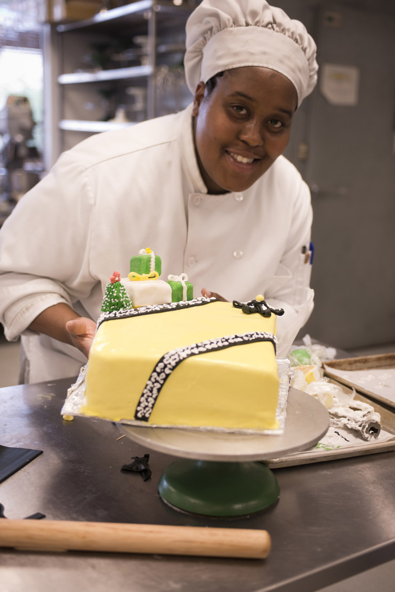 Culinary student with cake