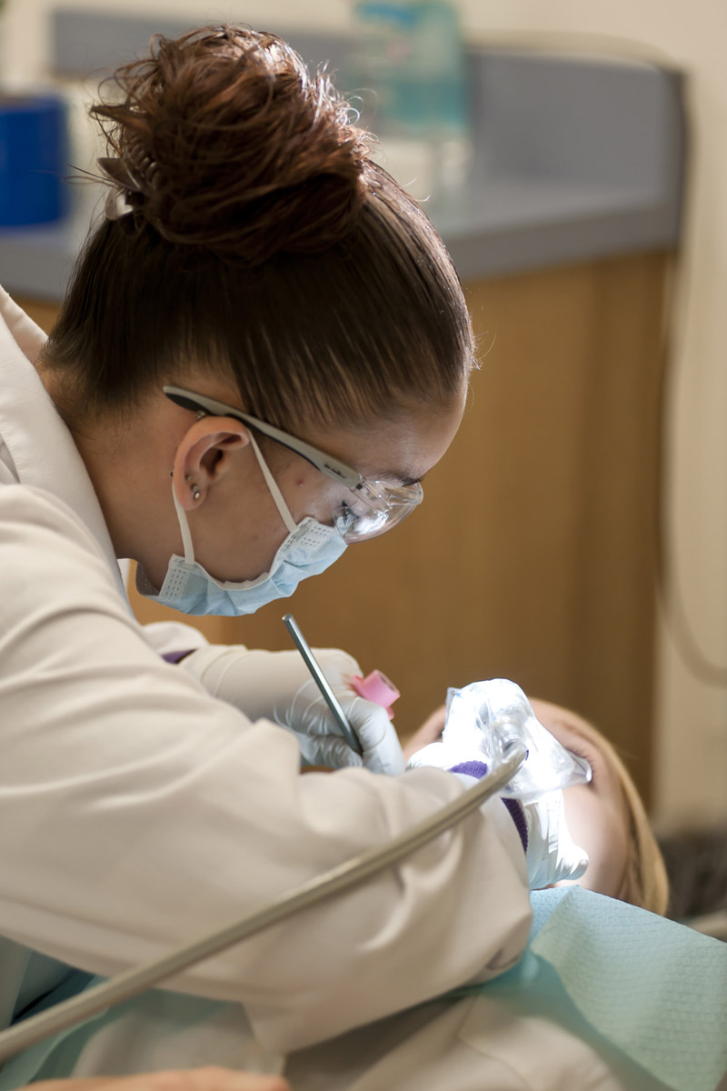 dental assisting student giving an exam