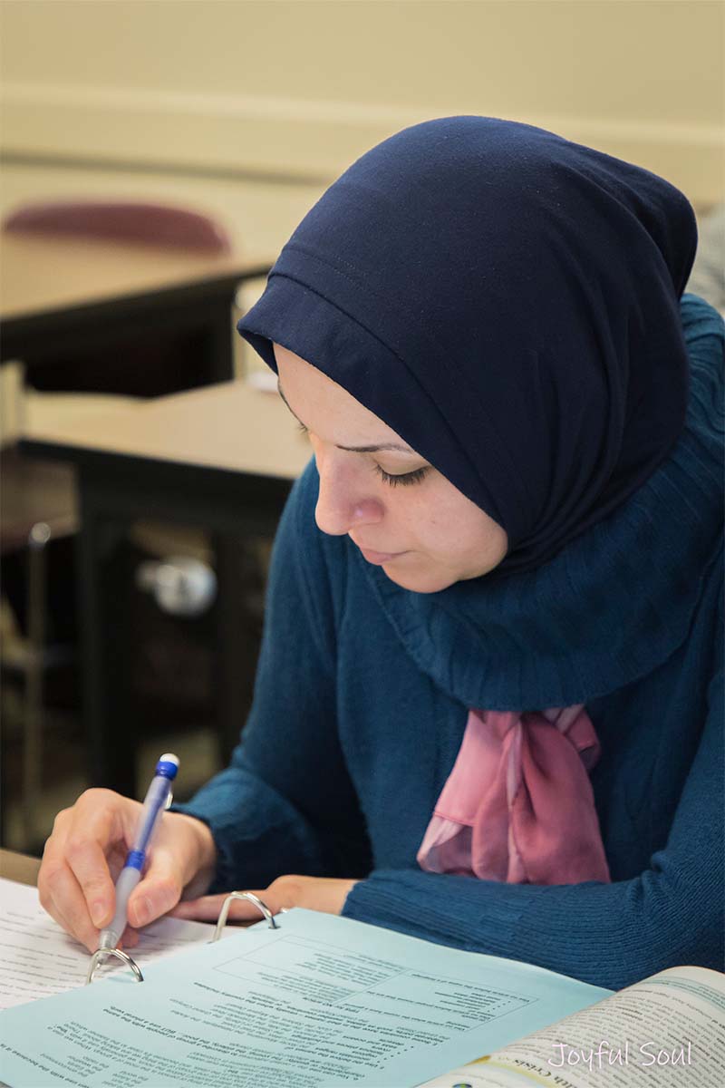 Woman in hijab doing classwork