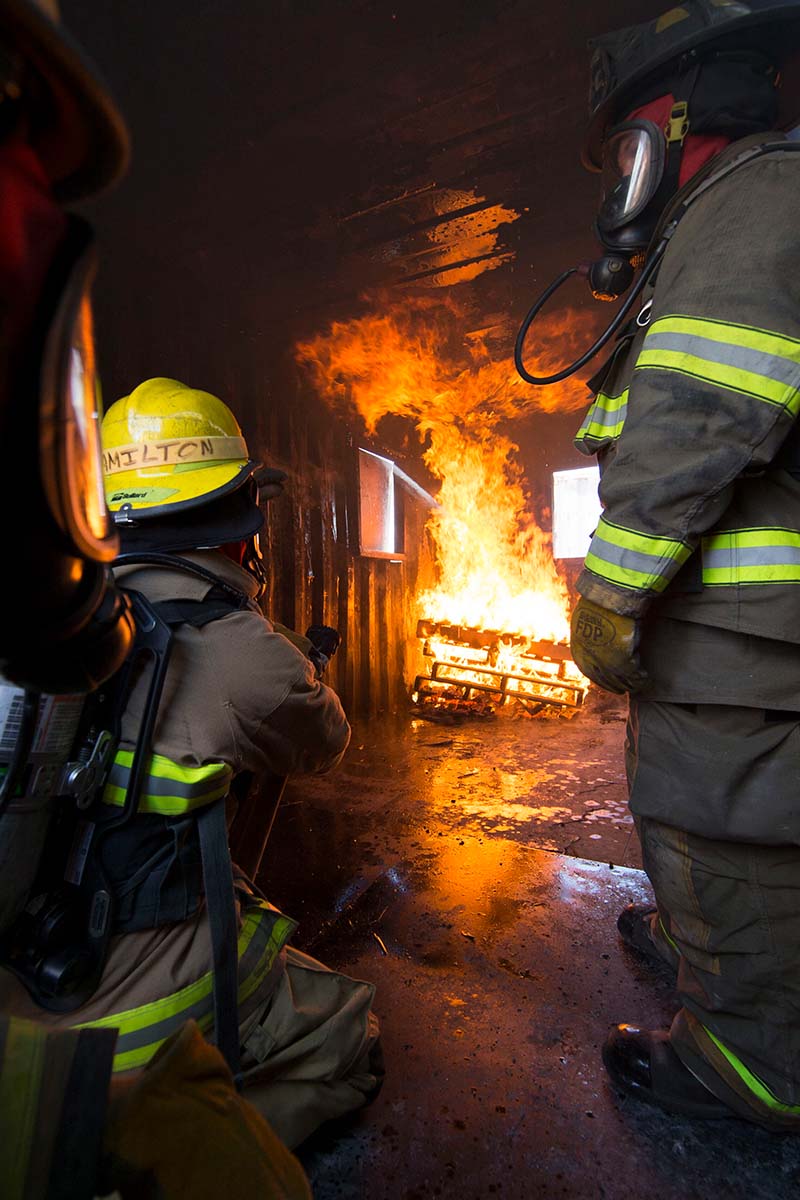 Pikes Peak State College fire science students practice putting out fires during a training activity.