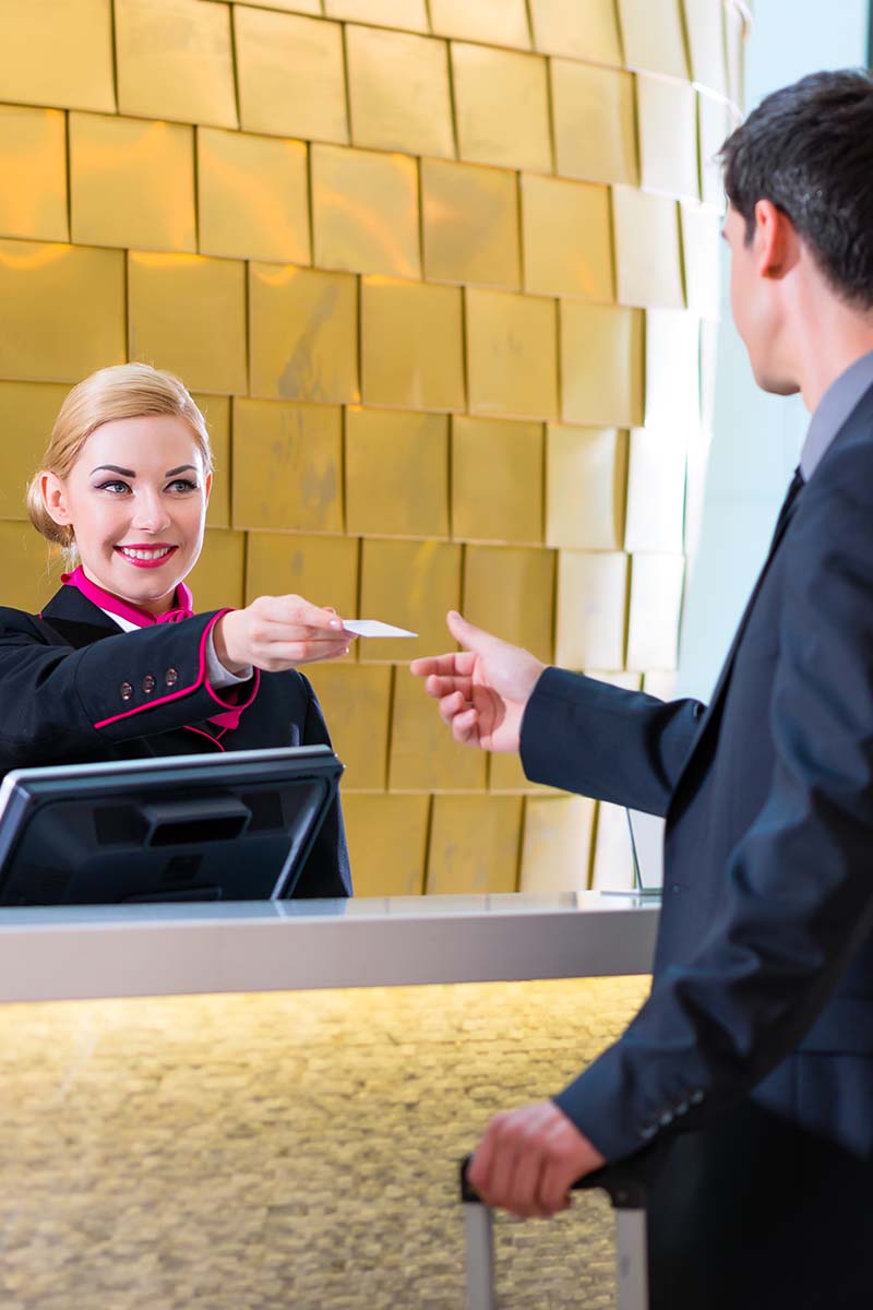 Receptionist at hotel desk