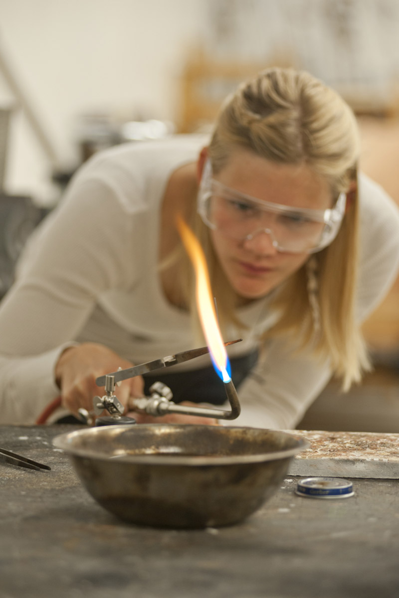 Student working with a bunsen burner