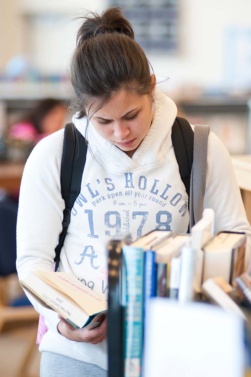 Girl looking at books