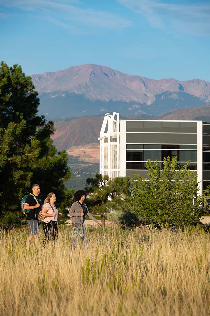 Students walking outside the Rampart Range Campus. 