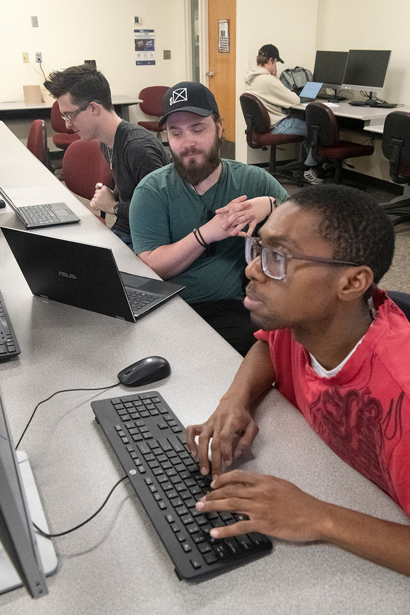 Two students working on computers