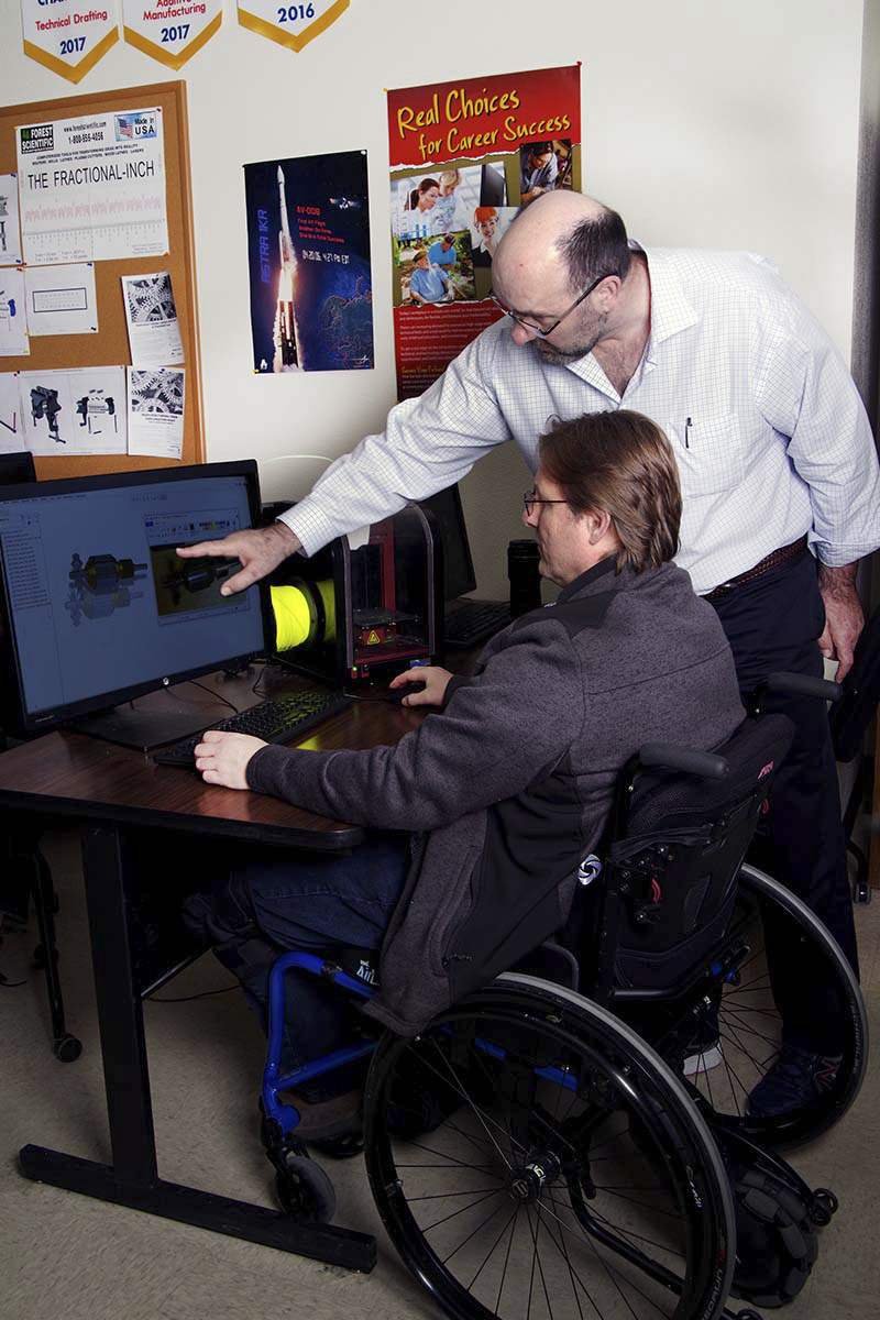 robotics student working on computer