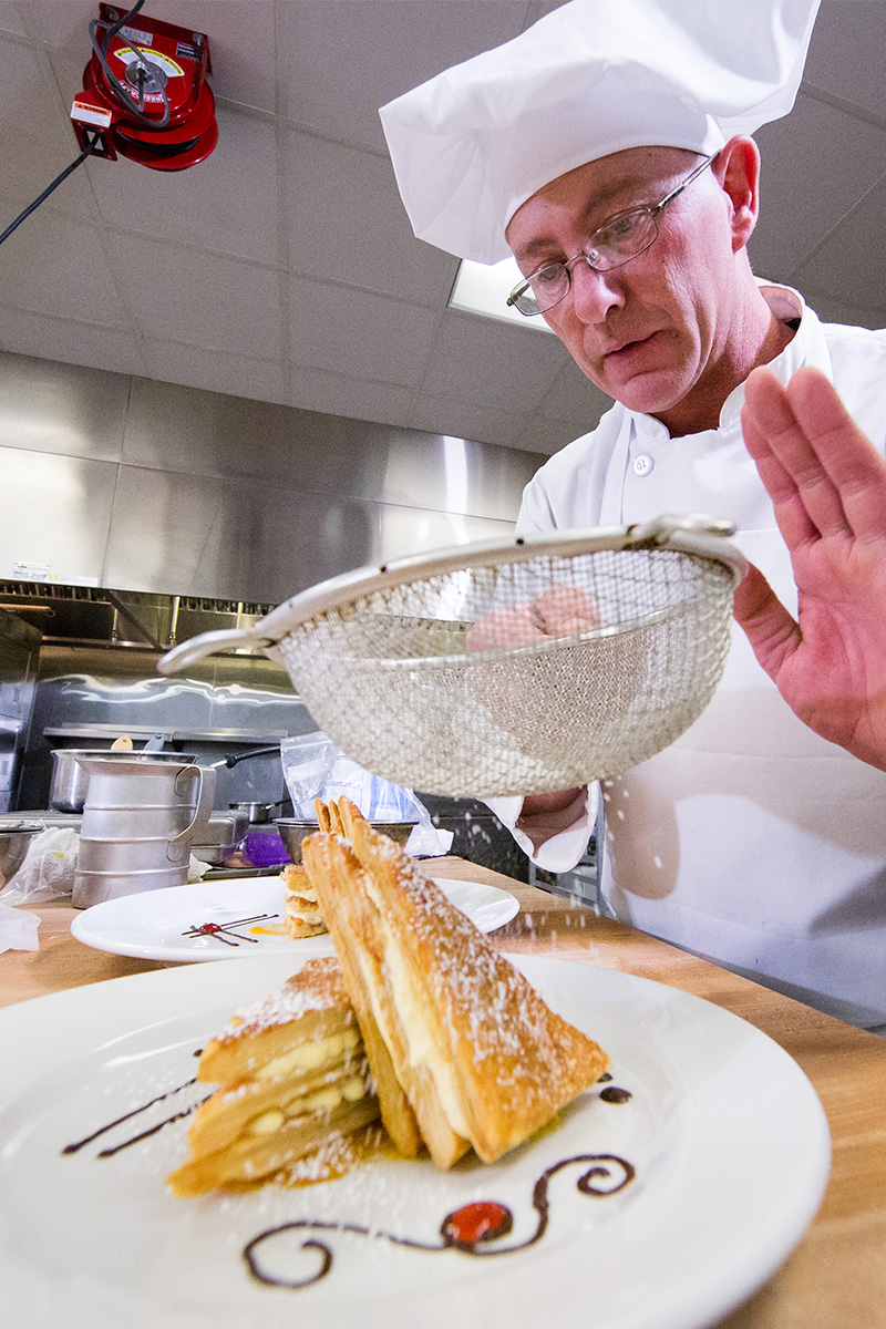 chef decorating dessert