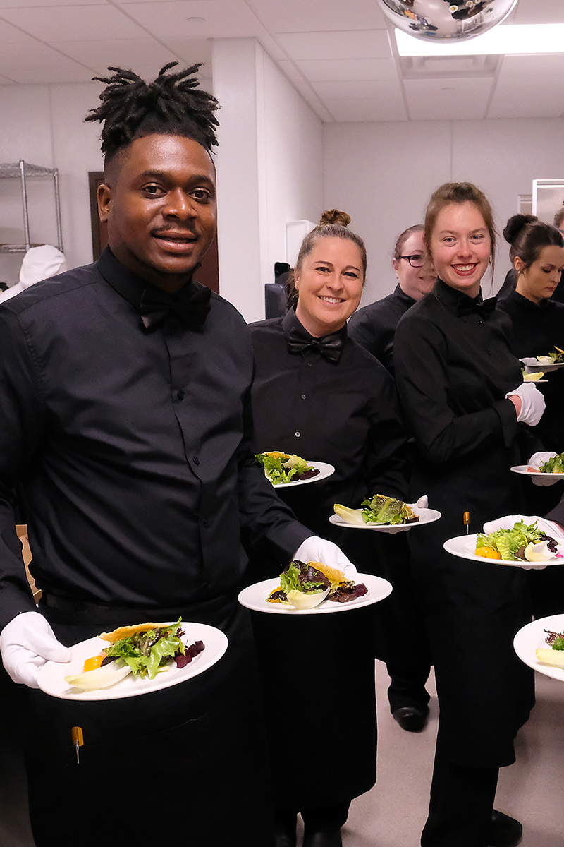students serving plates