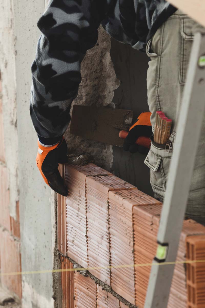 worker laying brick