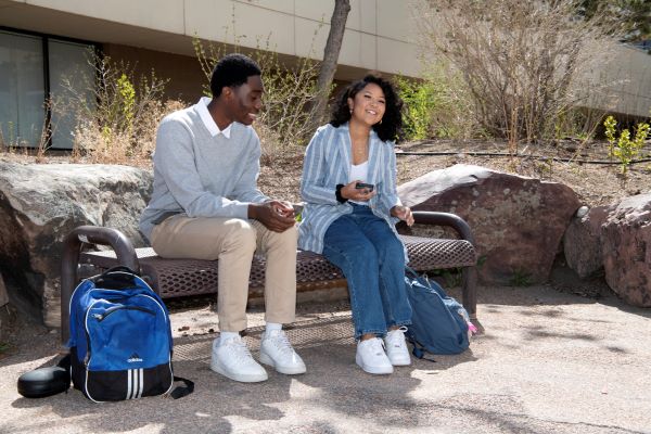 ppsc students on bench outside at Centennial Campus