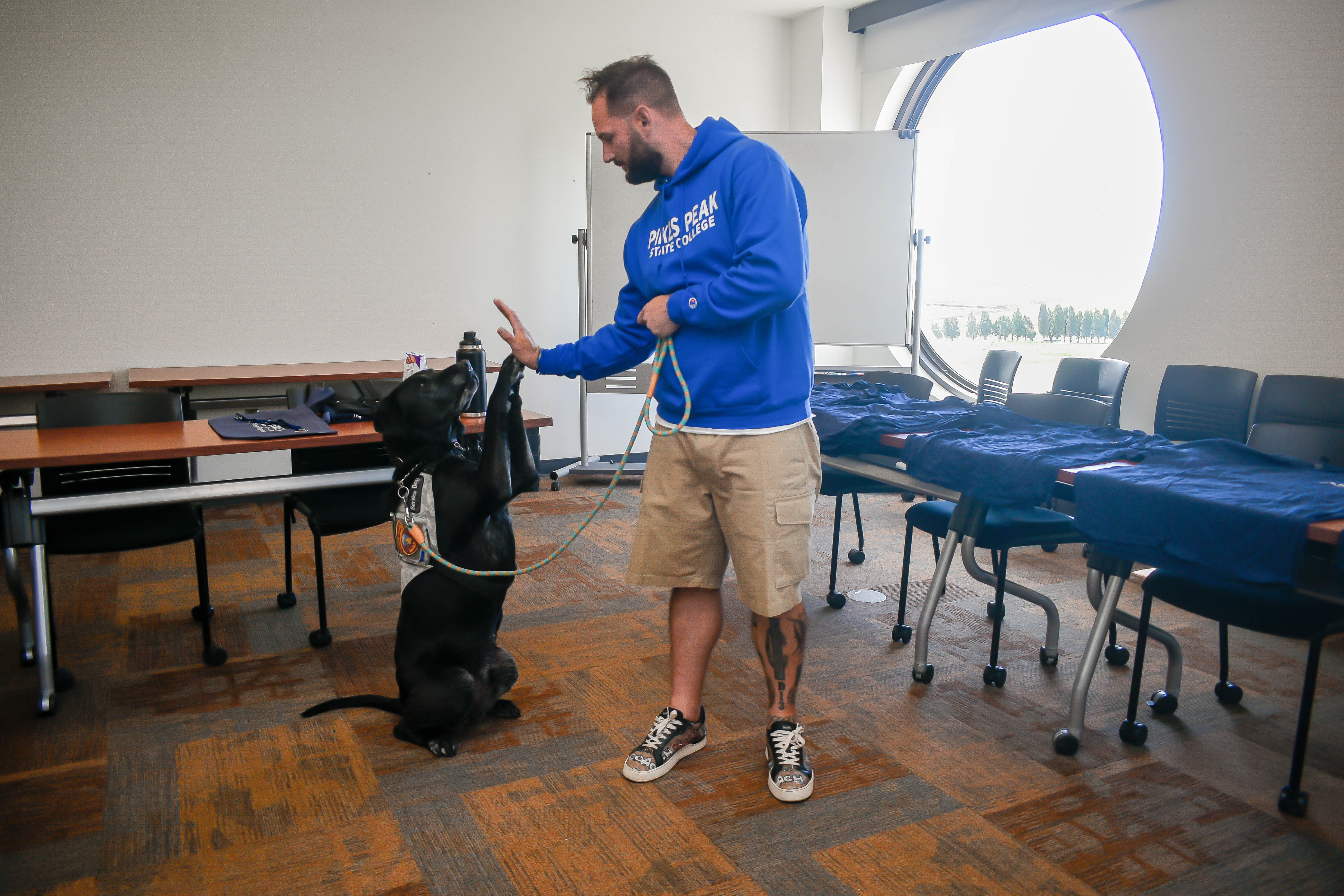 military student with service dog on campus