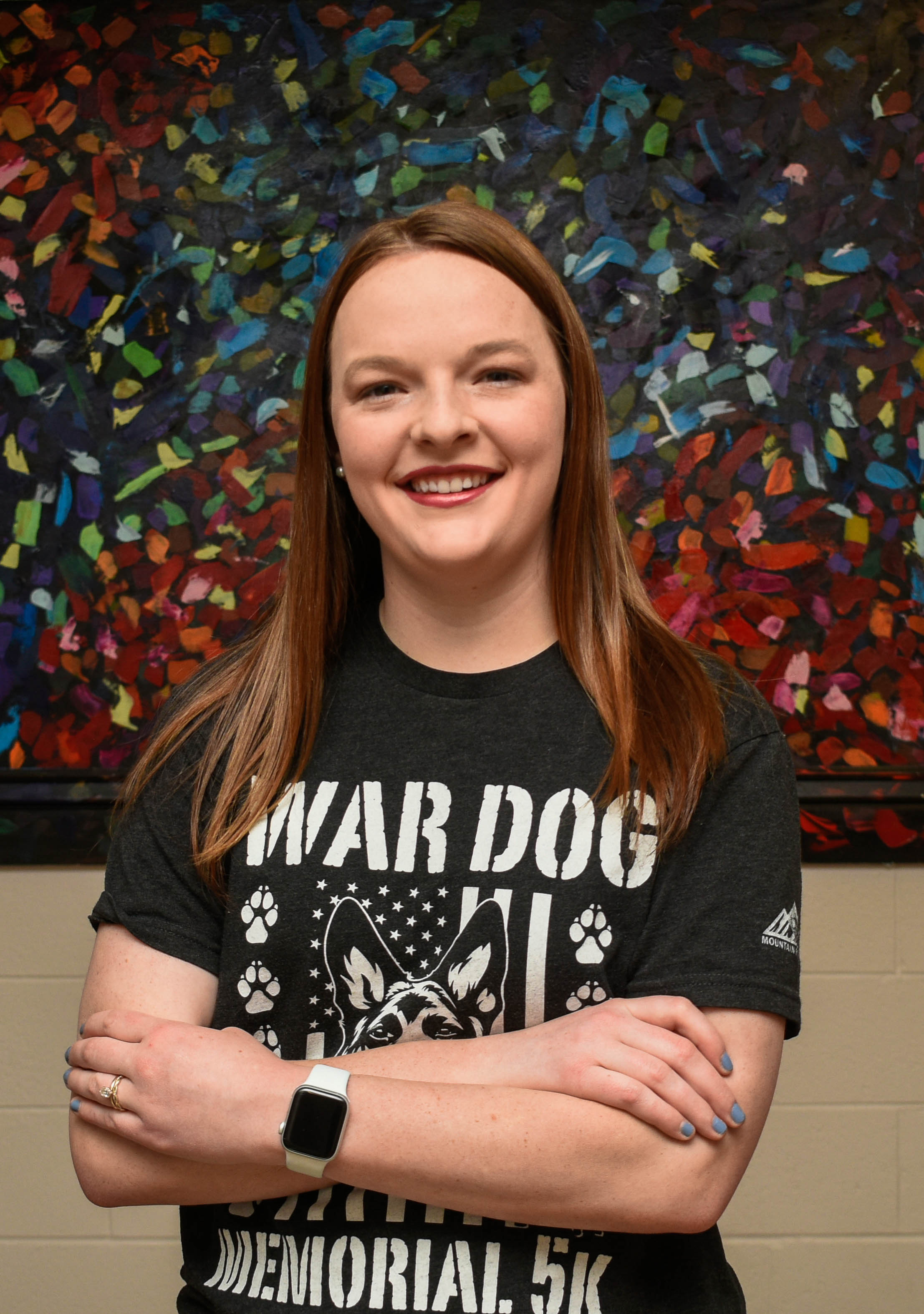 military student in front of artwork