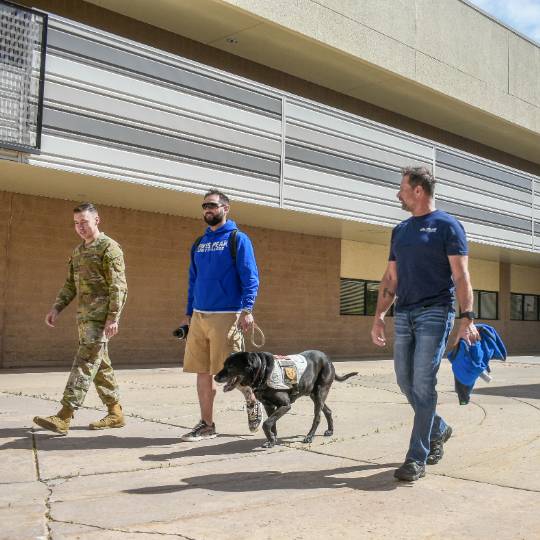 Three military affiliated students walking together 
