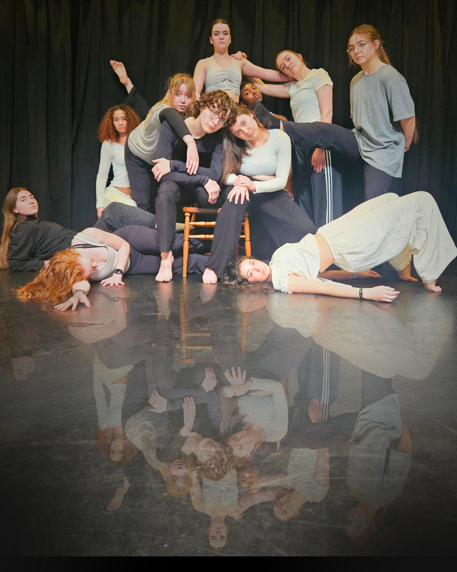 dance students jumping with umbrellas 